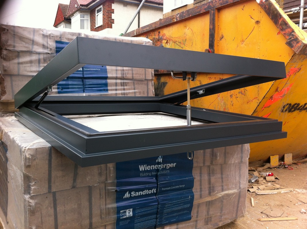 Opening flat roof skylight in anthracite grey installed in Lambeth